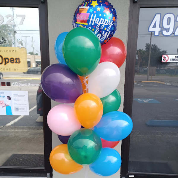 Colorful balloon bouquet with a Happy Birthday balloon on a stand