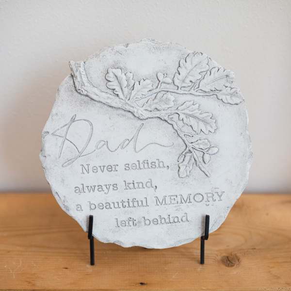 Memorial stone plaque with an oak leaf design and the word Dad
