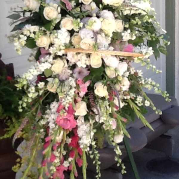 Large standing floral spray with white and pink flowers
