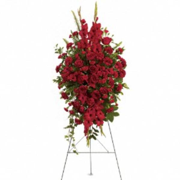 Tall standing spray of red flowers on an easel