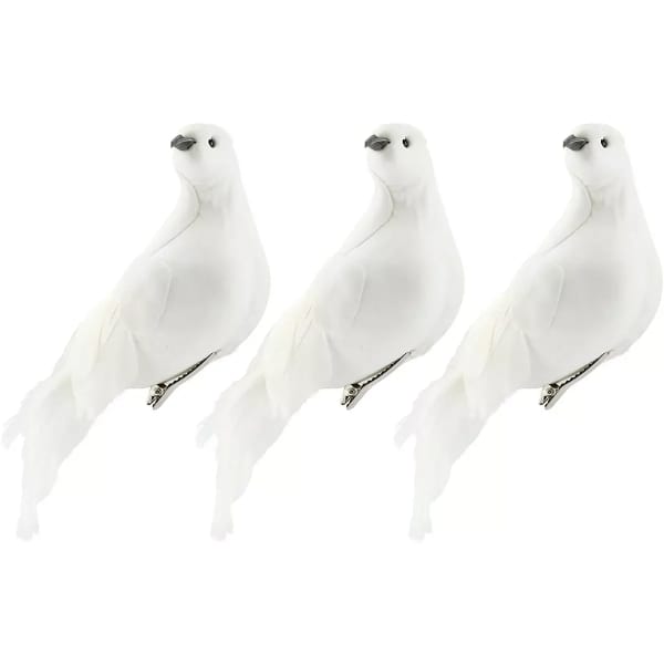 Three white decorative bird clips on a white background