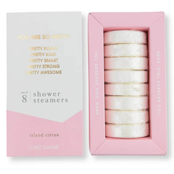 Pink and white box of shower steamers with gold lettering