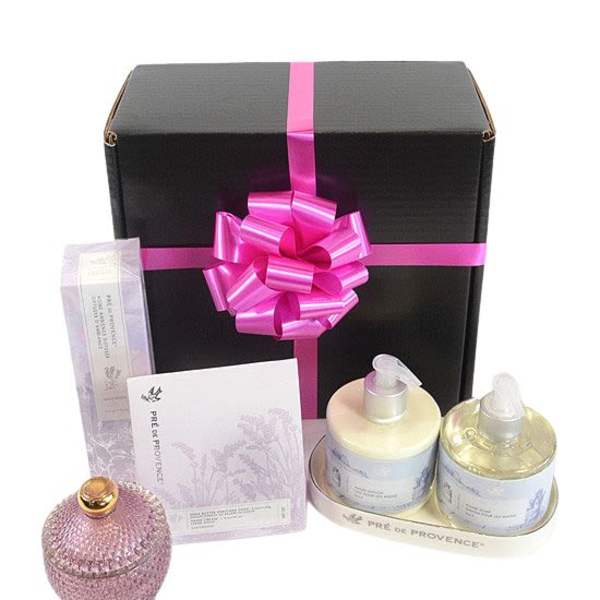 Gift box with pink ribbon and assorted bath products