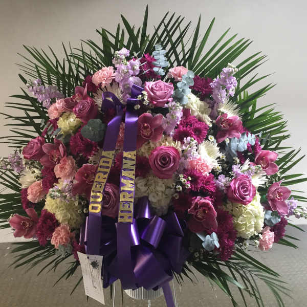 Large pink and purple floral standing spray with ribbon