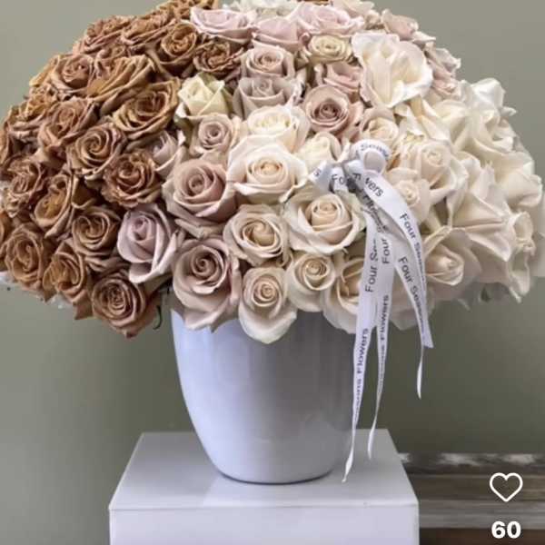 Large bouquet of roses in a white vase