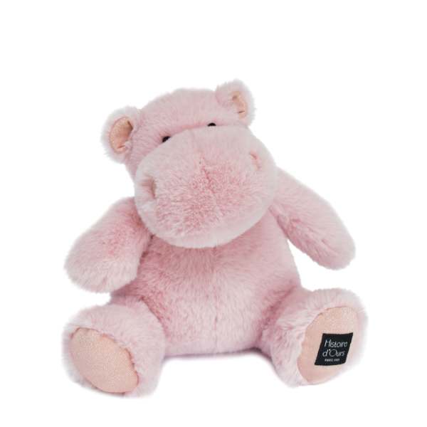 Pink plush teddy bear sitting on a white background