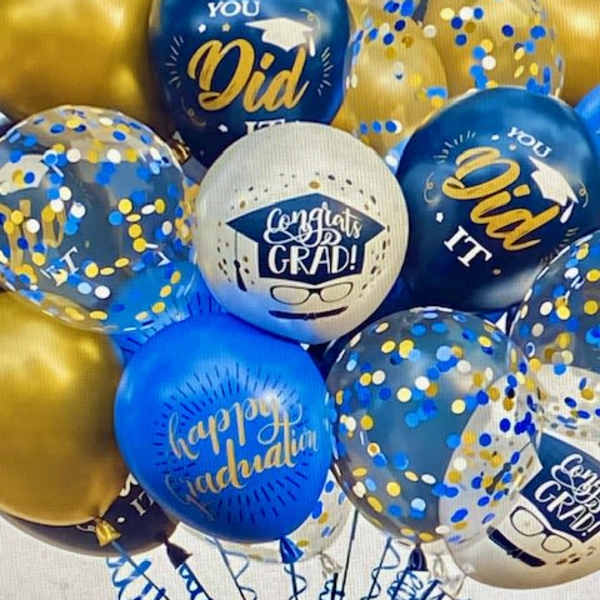 Cluster of blue and gold graduation balloons with confetti and printed messages