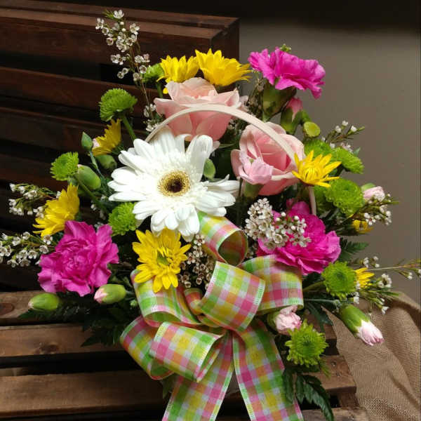 Mixed flower basket with pink roses, white gerbera daisy, and bright ribbon
