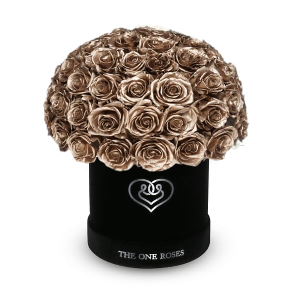 Bouquet of metallic gold roses in a black hat box