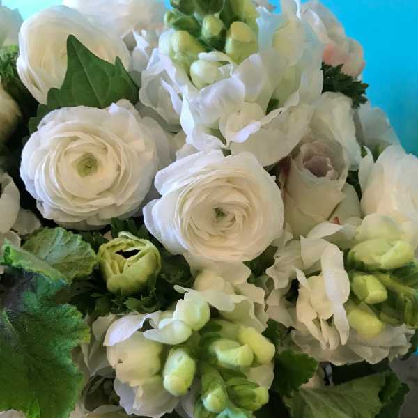 White ranunculus and pale green hydrangea bouquet