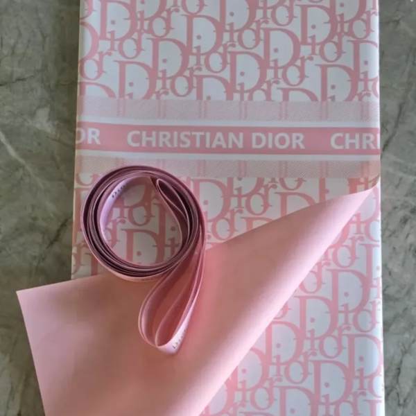 Pink Dior gift box wrapped with a satin ribbon