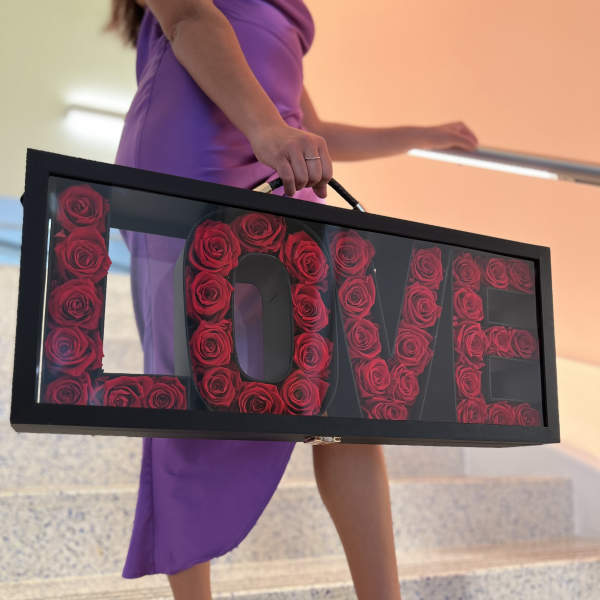 Framed rose arrangement spelling LOVE