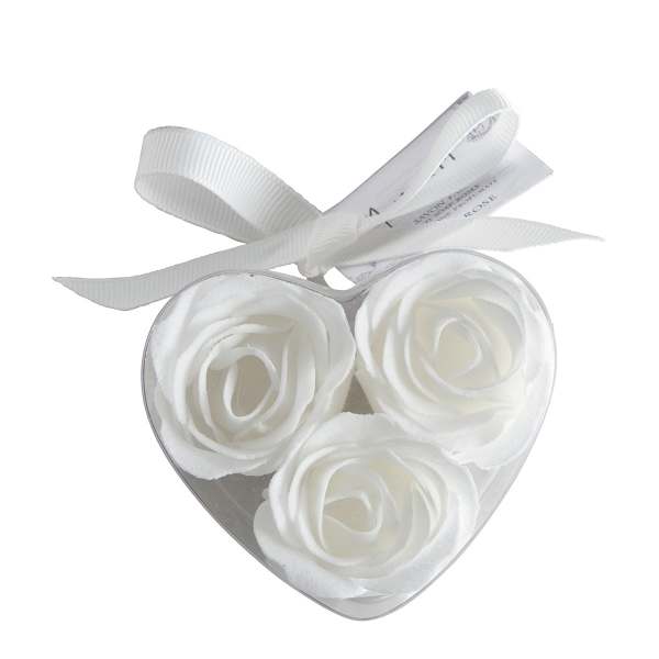 Heart-shaped box with three white roses and a ribbon bow