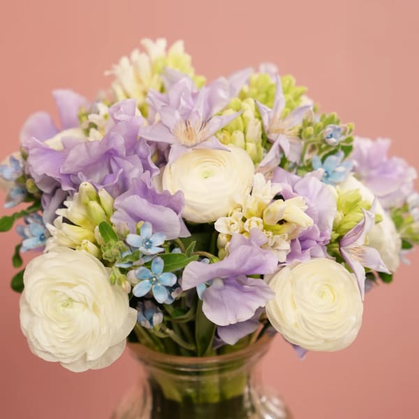 Lavender and white mixed bouquet in a glass vase