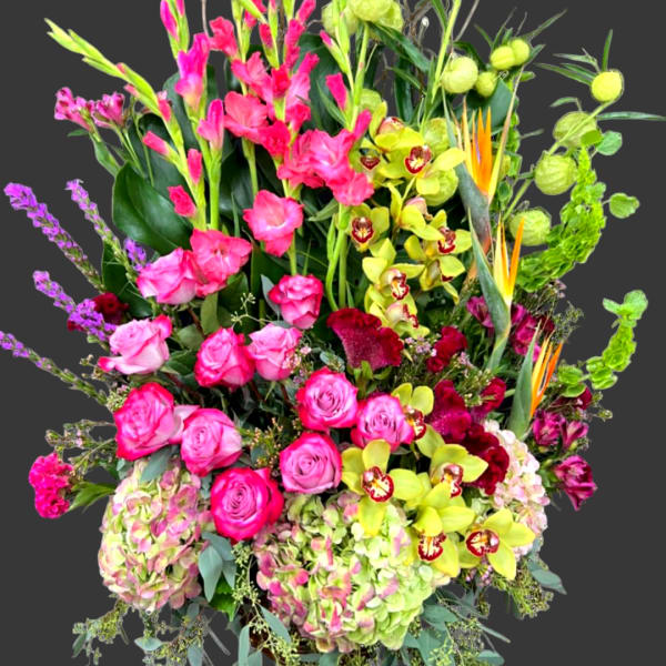 Tall mixed bouquet with pink roses, orchids, and green hydrangeas