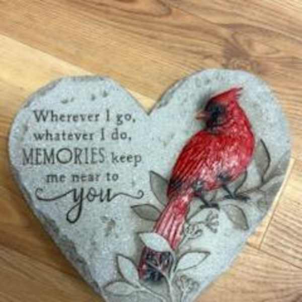 Heart-shaped decorative plaque with a red cardinal and memorial text