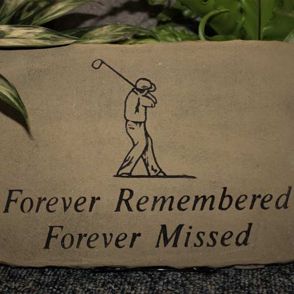 Memorial stone with a golfer illustration and the words Forever Remembered Forever Missed