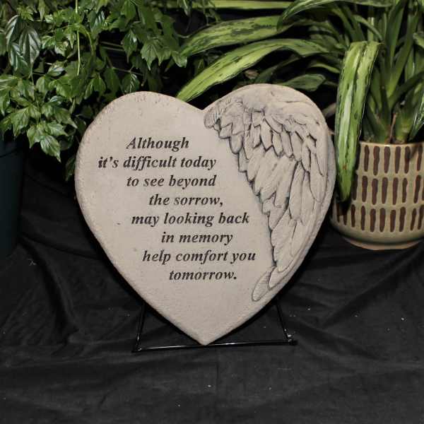 Heart-shaped memorial plaque with angel wing design and sympathy text
