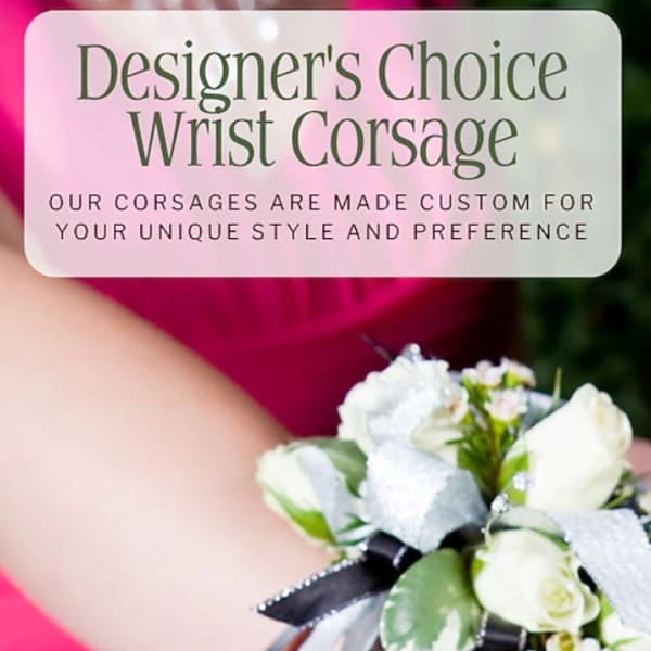 White wrist corsage with small roses and ribbon