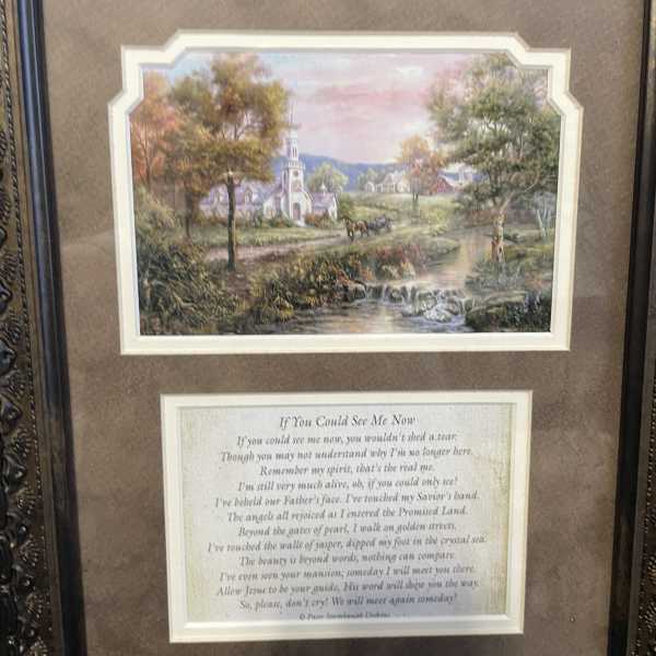 Framed landscape print above a memorial poem plaque