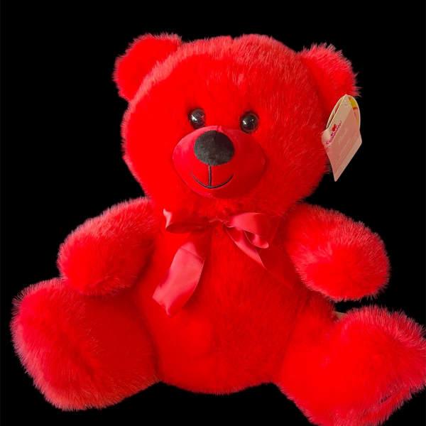 Red plush teddy bear with a ribbon bow