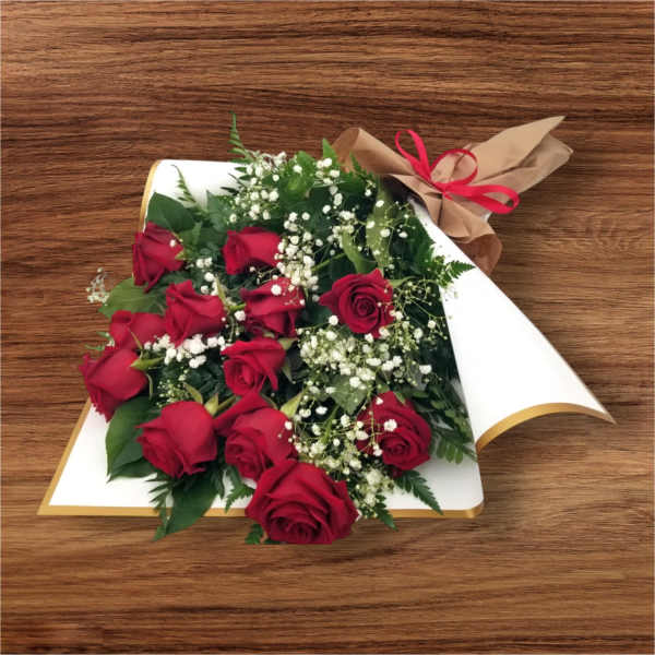 Bouquet of red roses with baby's breath in white wrap