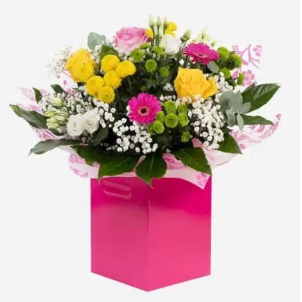 Mixed bouquet in a bright pink gift box