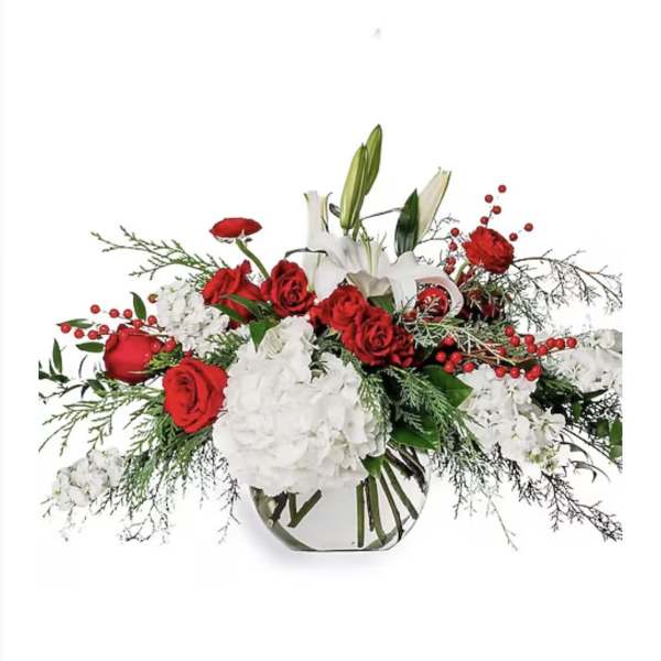 Red roses and white lilies in a clear glass vase