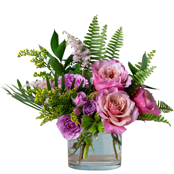 Pink and purple roses in a clear glass vase