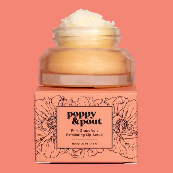 Pink grapefruit lip scrub in a jar on a peach box