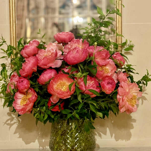 Pink peony bouquet in a glass vase