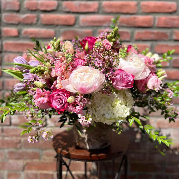 Pink and white mixed flower arrangement in a vase