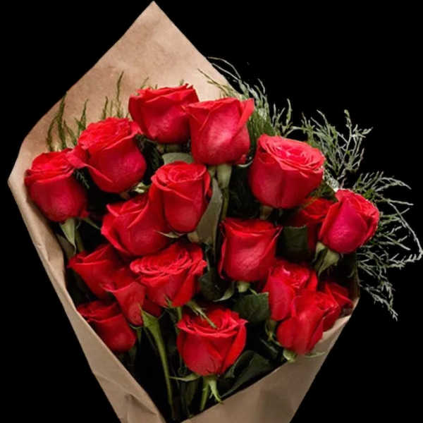 Bouquet of red roses wrapped in brown paper