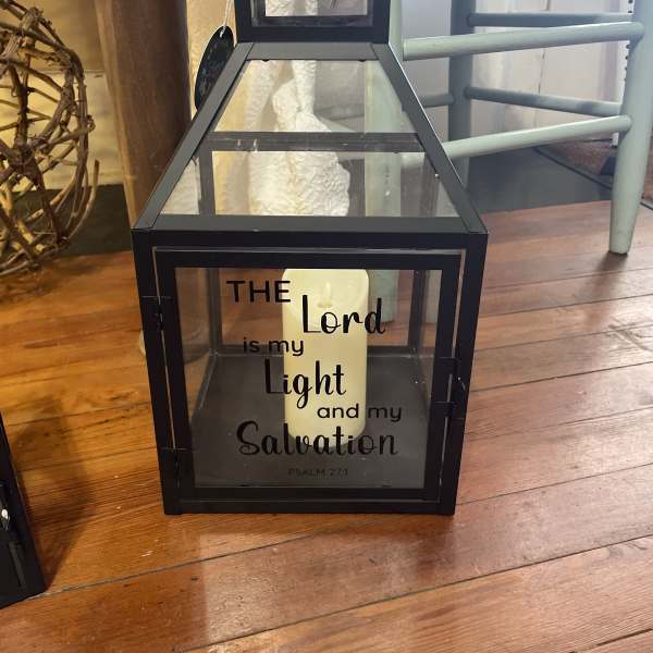 Black lantern with a candle and Psalm 27:1 text