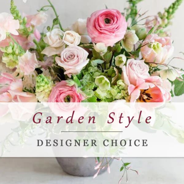 Pink and white mixed flower arrangement in a gray vase