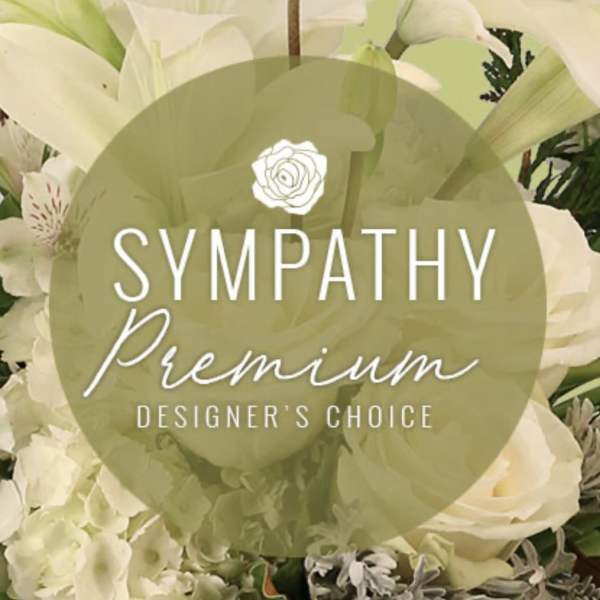 White sympathy floral arrangement with roses and lilies
