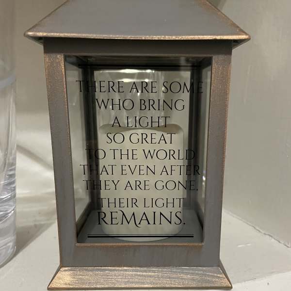Decorative lantern with a memorial quote inside