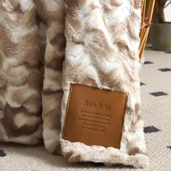 Faux fur blanket with a John 3:16 leather patch