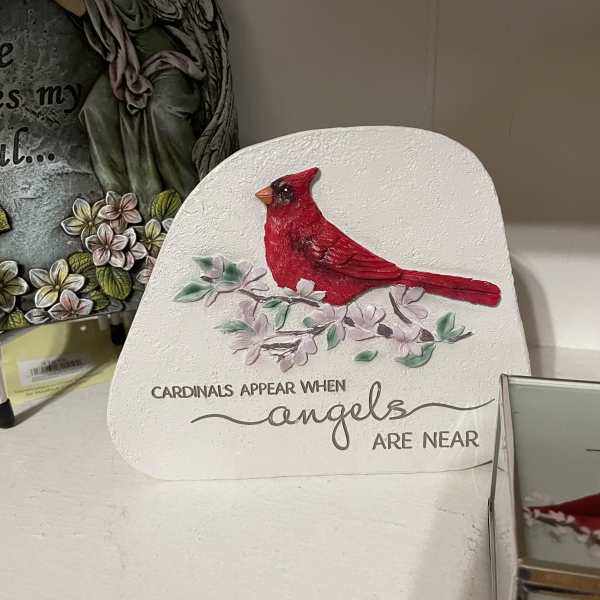 Decorative plaque with a red cardinal and floral accents