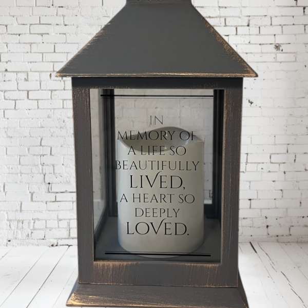 Decorative lantern with a memorial candle inside