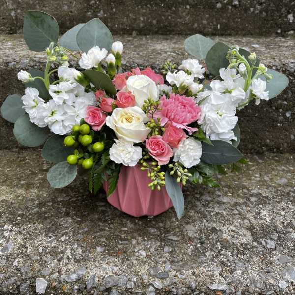 Pink and white bouquet in a pink wrap with eucalyptus