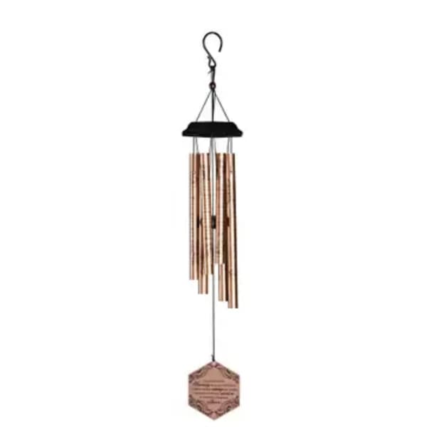 Hanging metal wind chime with copper tubes and a hexagonal tag