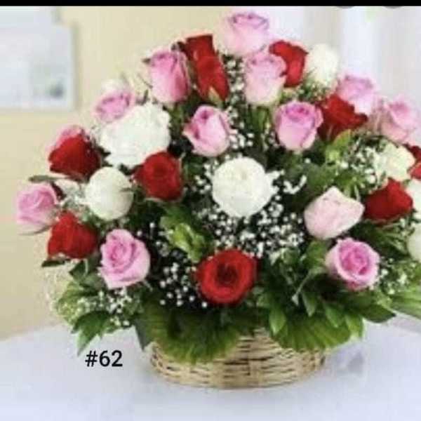Basket arrangement of red, pink, and white roses