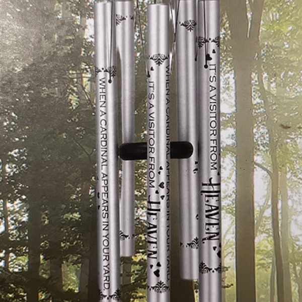 Silver memorial wind chime hanging outdoors