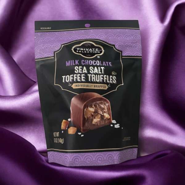 Bag of milk chocolate sea salt toffee truffles on purple satin