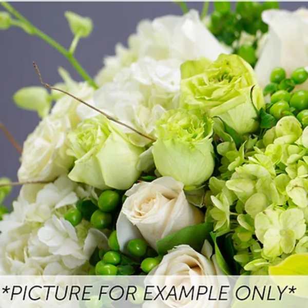 Green and white floral arrangement with roses and hydrangeas