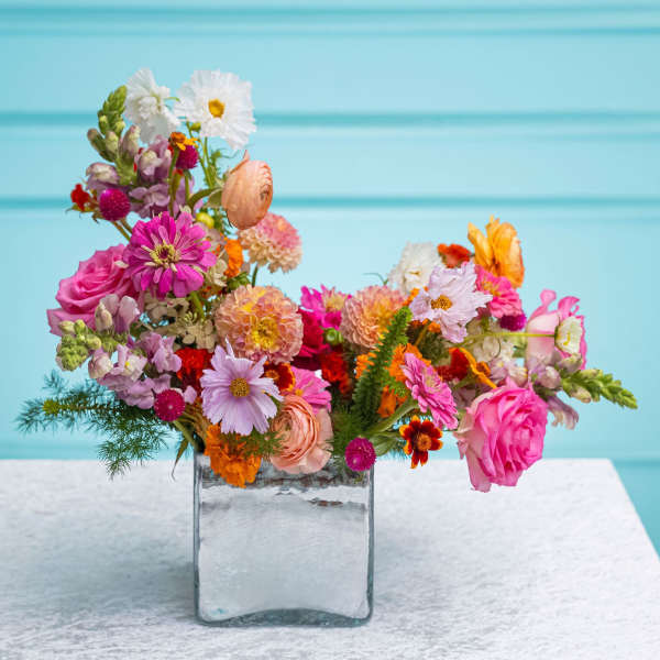 Colorful mixed bouquet in a clear glass vase