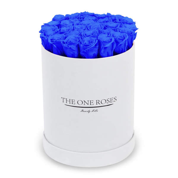 Blue roses arranged in a white round box