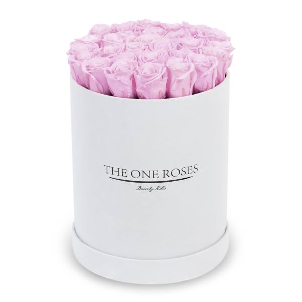 Pink roses arranged in a white round box