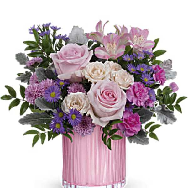 Pink and white roses with purple flowers in a pink glass vase